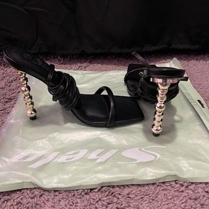 Black and gold heels